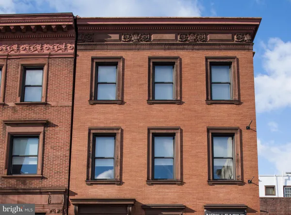 a view of building with front door and windows