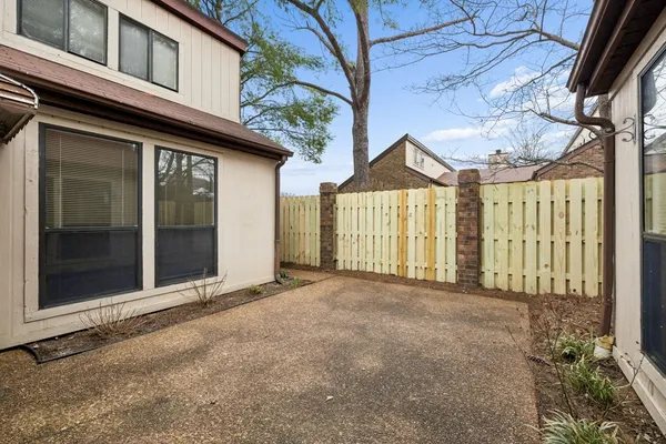 a view of a house with a wooden floor and a window