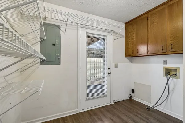 a kitchen with a sink a refrigerator and cabinets