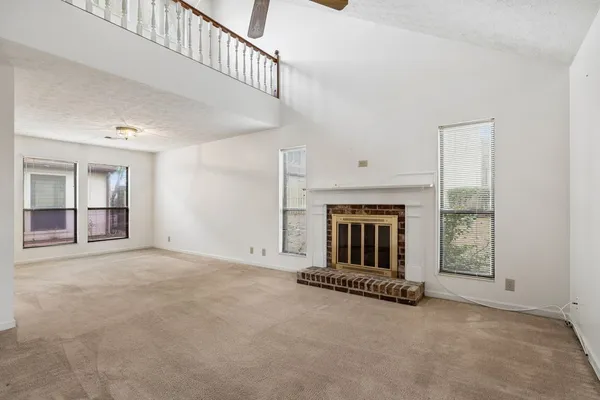 a view of staircase with rug
