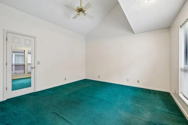 a view of a livingroom with a fan and hardwood floor