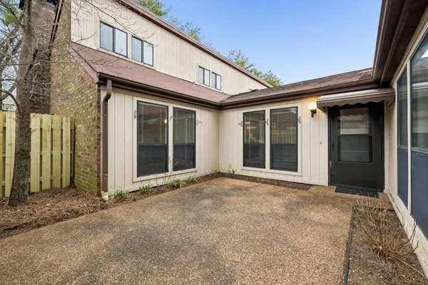 a front view of a house with a large window