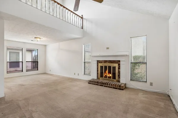 an empty room with fireplace