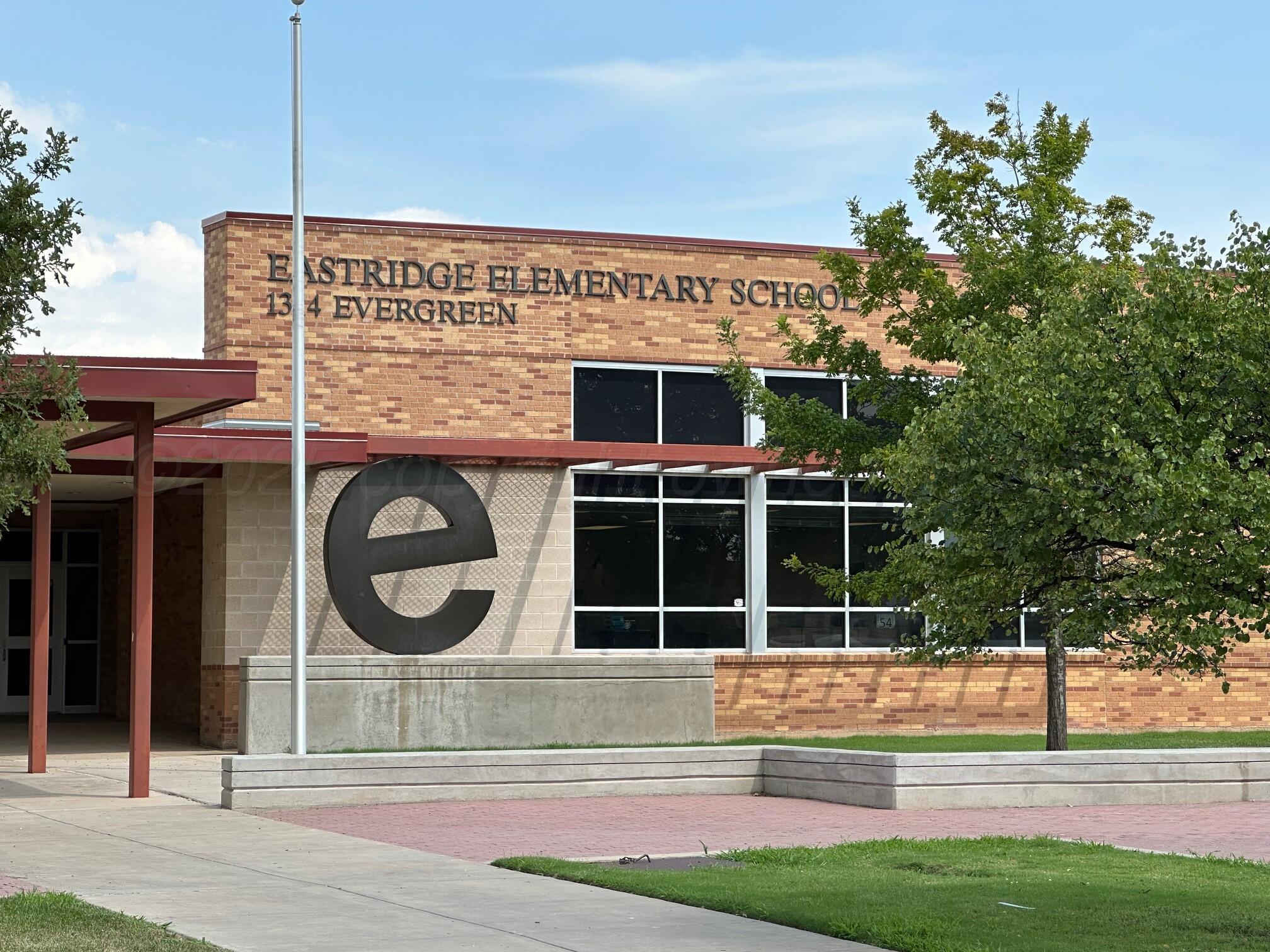 1607 Evergreen Street Amarillo, TX 79107 - Photo 16 of 18 a view of a house with a backyard
