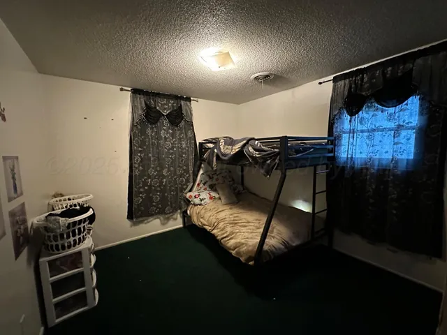 a bedroom with a bed and a closet