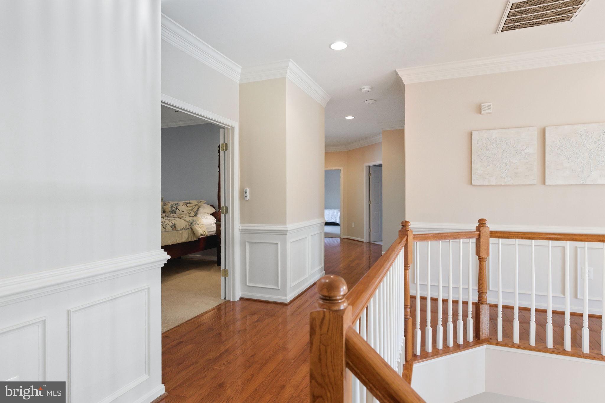 22455 Pine Ridge Court Ashburn, VA 20148 - Photo 35 of 99 Upper Hallway wood floors