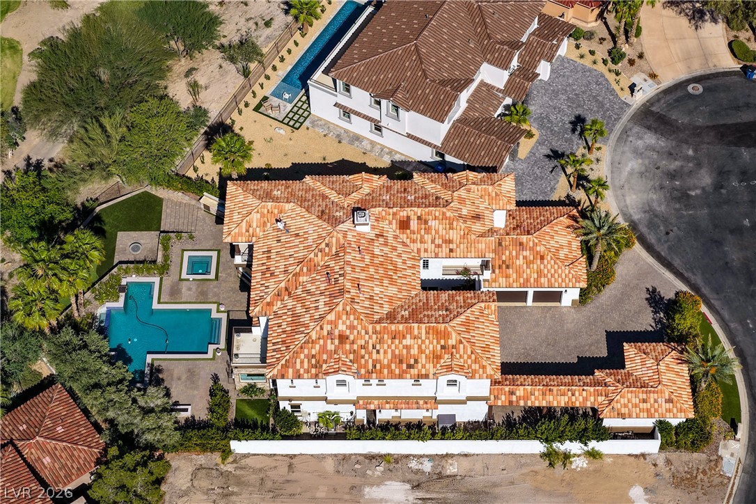 6 Rue Du Ville Henderson, NV 89011 - Photo 92 of 99 An aerial view showcases a sprawling estate with a distinctive tile roof and integrated outdoor living.