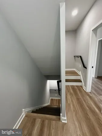 a white toilet sitting next to a bathroom sink