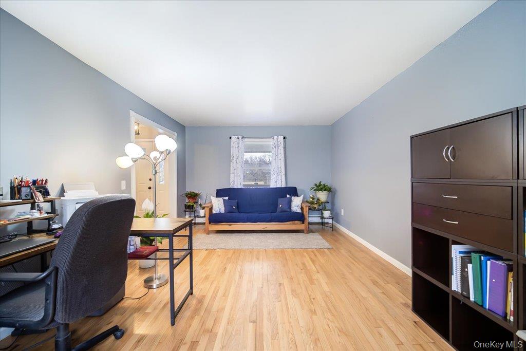 157 Brewer Road Newburgh, NY 12550 - Photo 12 of 50 This room features light hardwood floors and walls painted in a muted blue tone