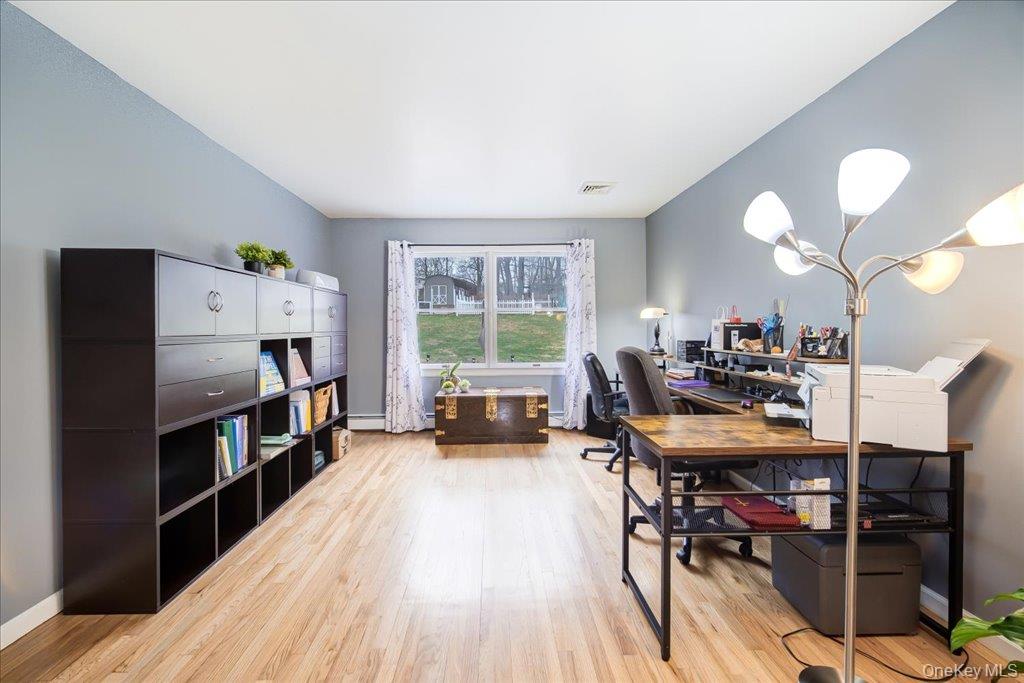 157 Brewer Road Newburgh, NY 12550 - Photo 13 of 50 This versatile space features light wood flooring, light grey walls, and a window providing views of the outdoors