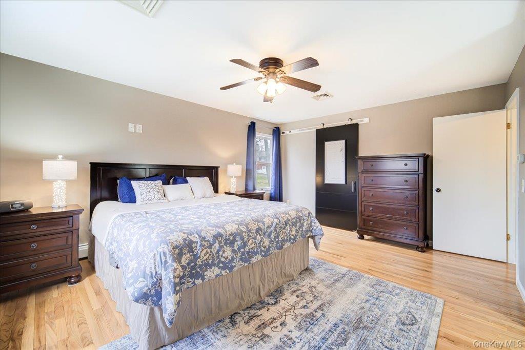 157 Brewer Road Newburgh, NY 12550 - Photo 23 of 50 The room features hardwood floors and a ceiling fan