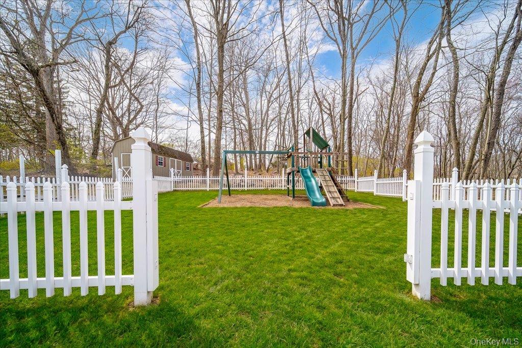 157 Brewer Road Newburgh, NY 12550 - Photo 42 of 50 Expansive fenced-in yard featuring a vibrant lawn and mature trees