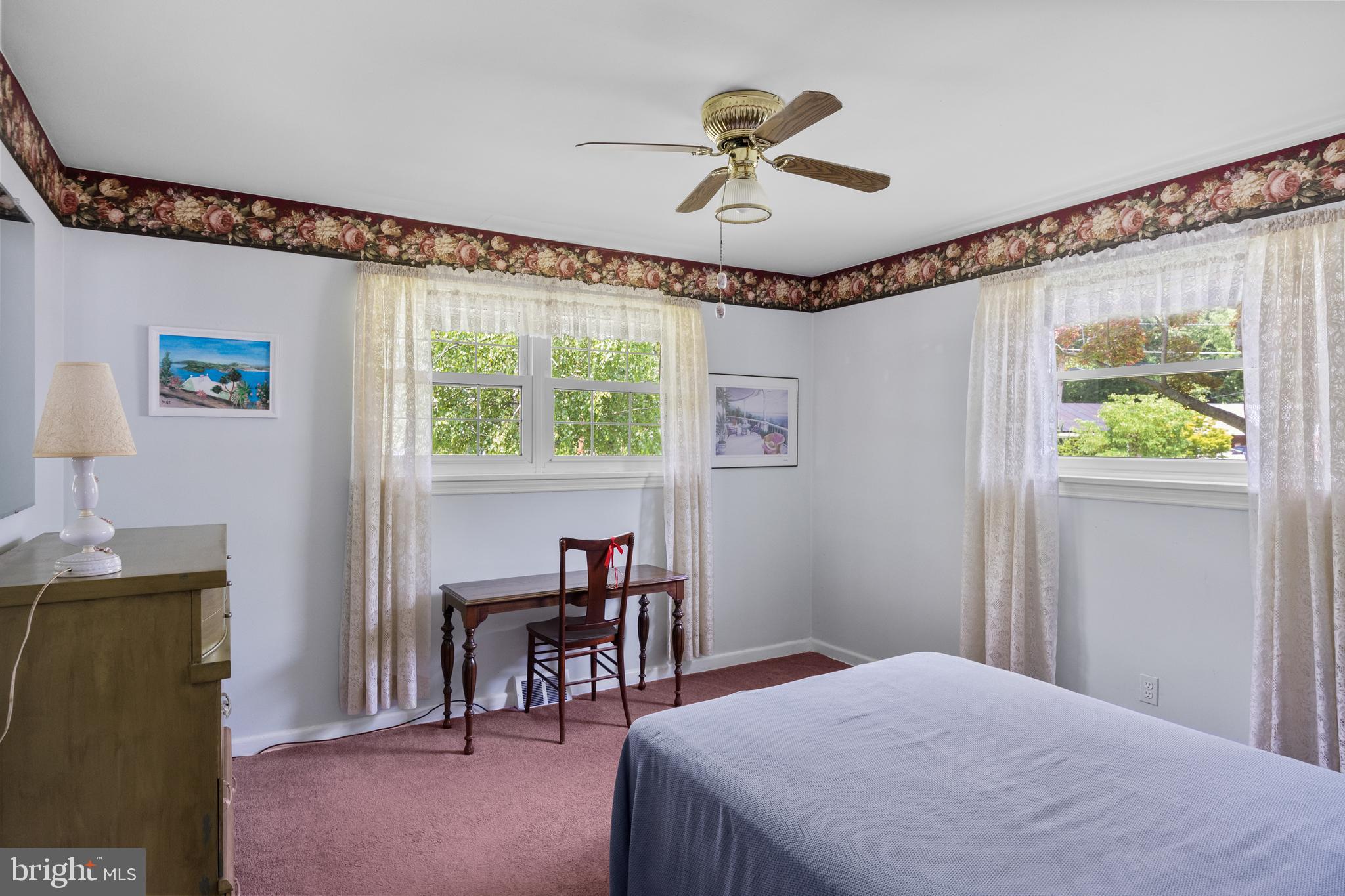 225 Buckner Avenue Haddonfield, NJ 08033 - Photo 11 of 24 a bedroom with a bed and a chandelier
