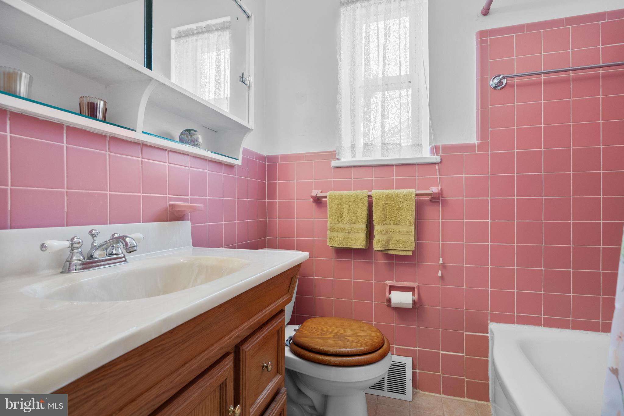 225 Buckner Avenue Haddonfield, NJ 08033 - Photo 14 of 24 a bathroom with a sink a toilet and a mirror