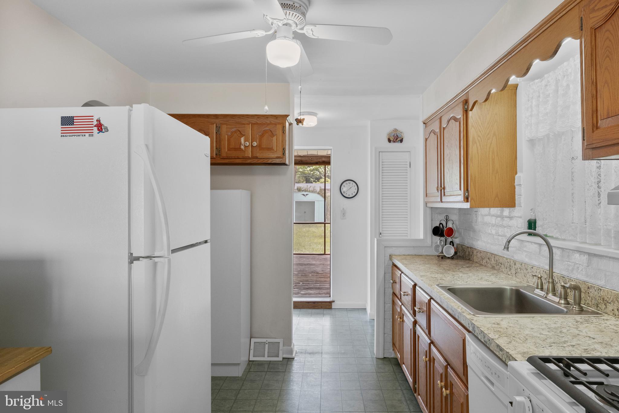 225 Buckner Avenue Haddonfield, NJ 08033 - Photo 10 of 24 a kitchen with stainless steel appliances granite countertop a refrigerator and a sink