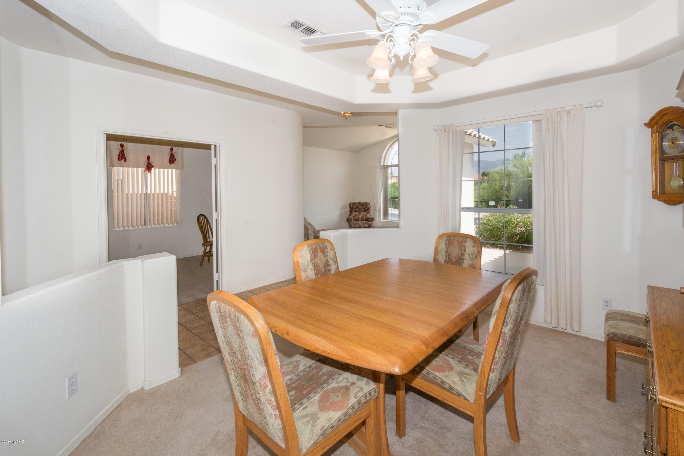 11341 Silver Pheasant Loop Oro Valley, AZ 85737 - Photo 13 of 41 a view of a dining room with furniture window and wooden floor