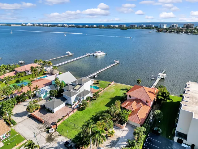 an aerial view of a house with a lake view