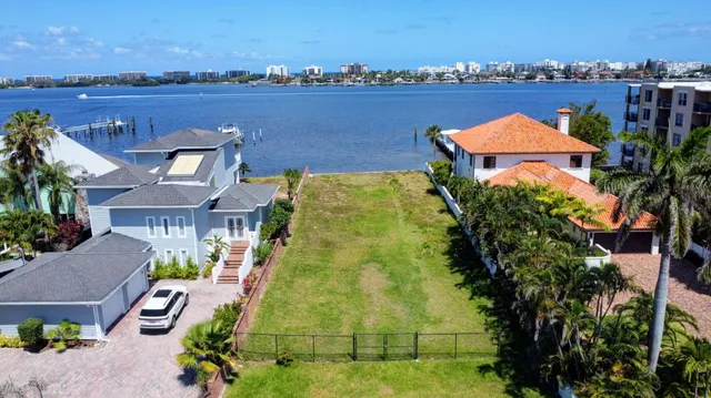 an aerial view of residential building with outdoor space and lake view
