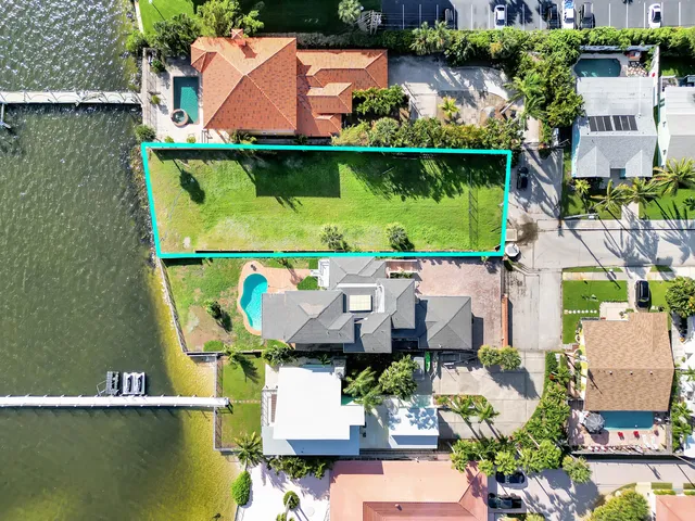 an aerial view of a house with a ocean view
