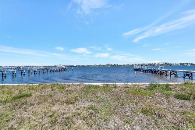 a view of a swimming pool and a yard