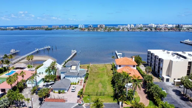 an aerial view of a house with a lake view