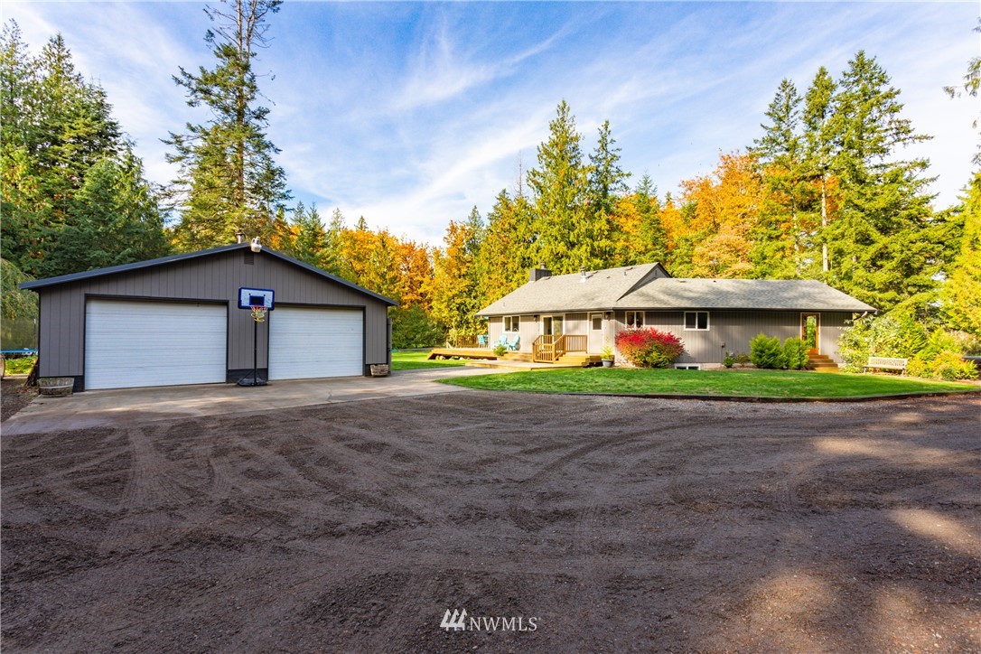 2291 East Pole Road Everson, WA 98247 - Photo 3 of 40 a front view of a house with yard and garage