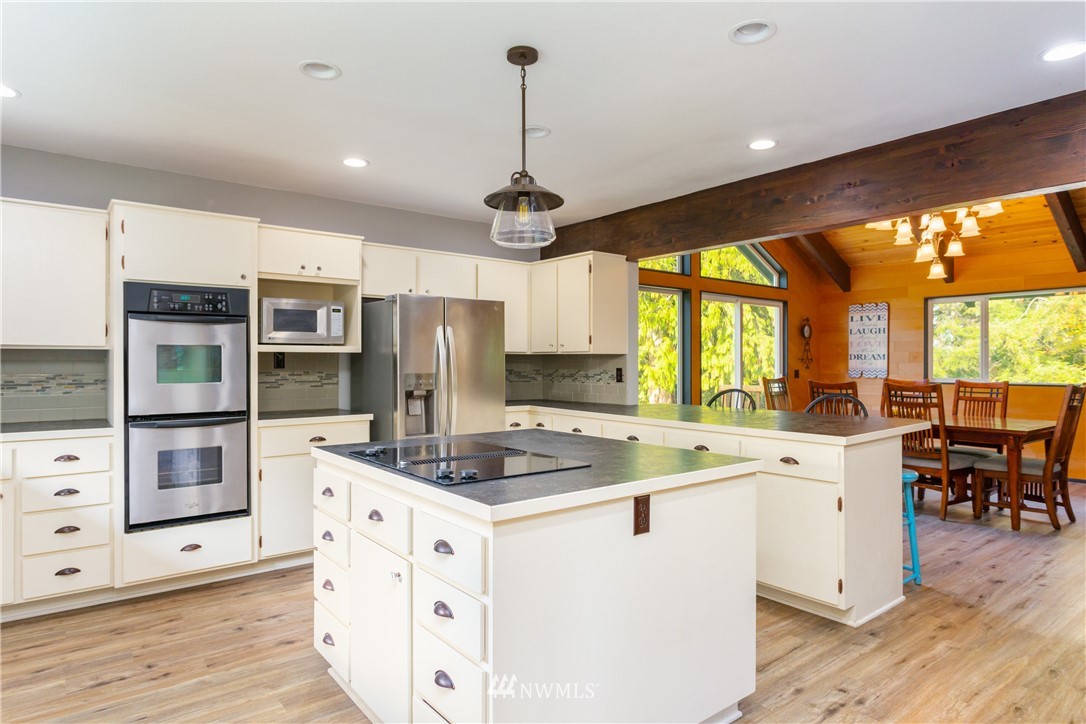 2291 East Pole Road Everson, WA 98247 - Photo 7 of 40 a kitchen that has a cabinets a sink and appliances