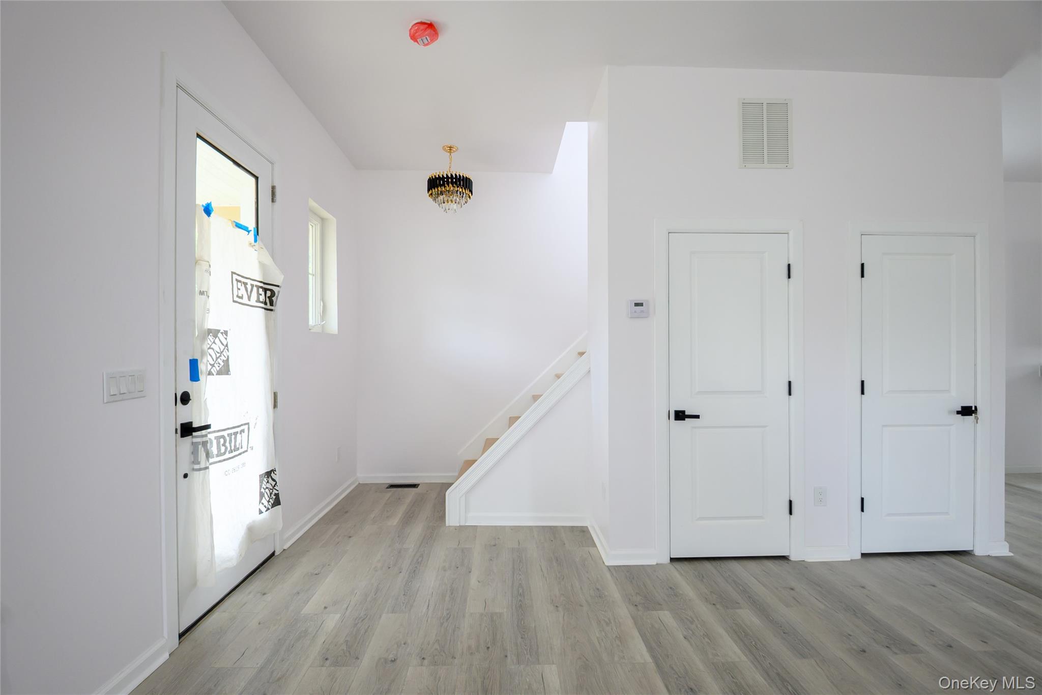 81 Silver Lake Sctn Road Middletown, NY 10940 - Photo 17 of 37 a view of an entryway with wooden floor