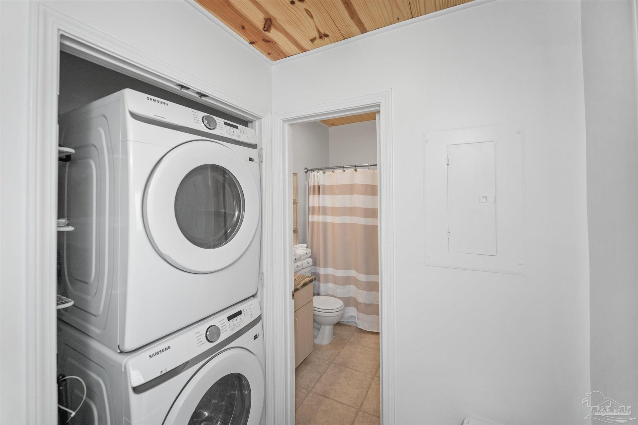 3575 Bayou Road, Unit A7 Orange Beach, AL 36561 - Photo 18 of 22 a utility room with dryer and washer