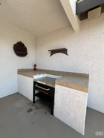 a kitchen with a sink and a refrigerator