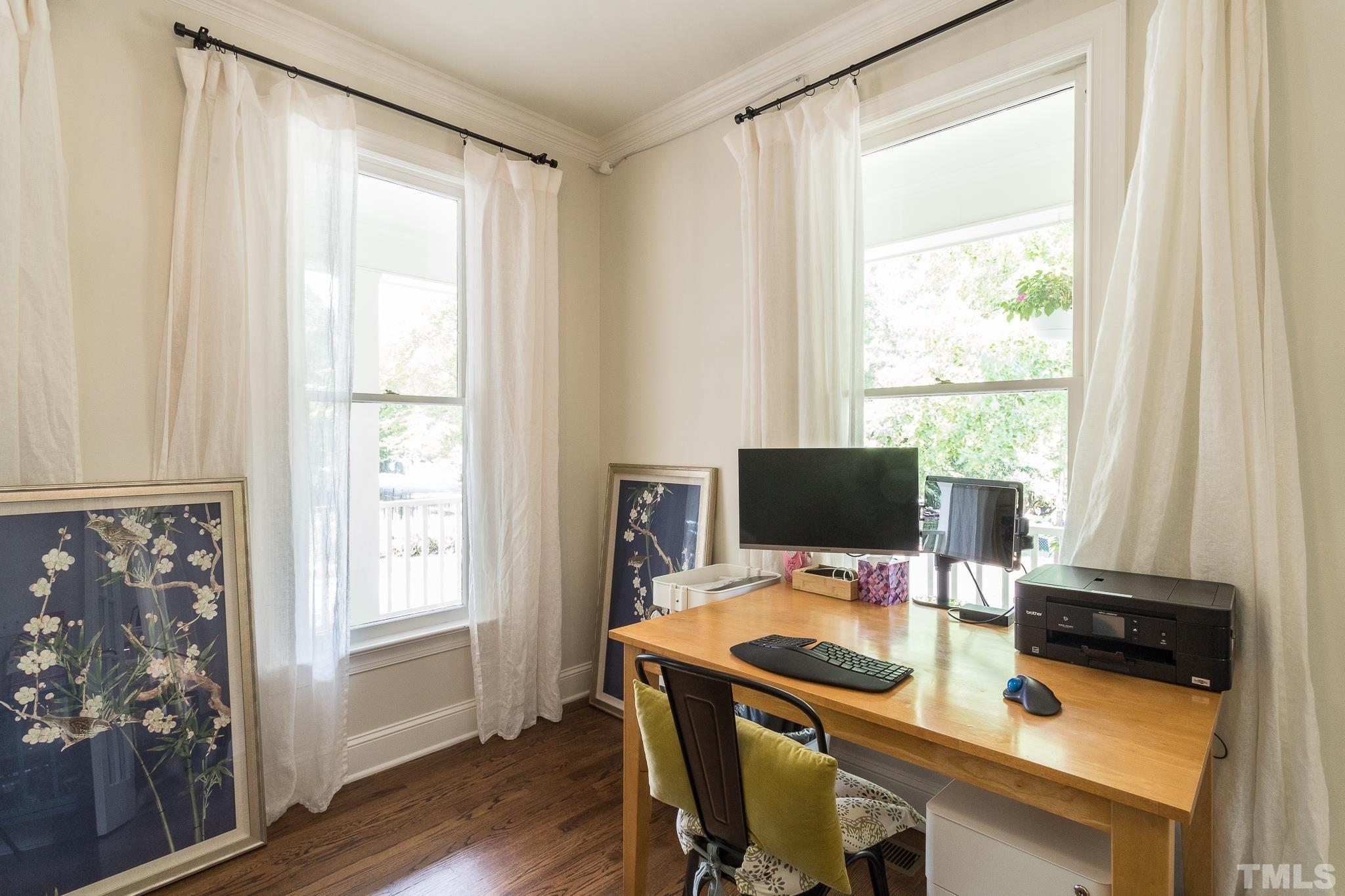 509 Watauga Street Raleigh, NC 27604 - Photo 14 of 26 a view of a workspace with furniture and a window