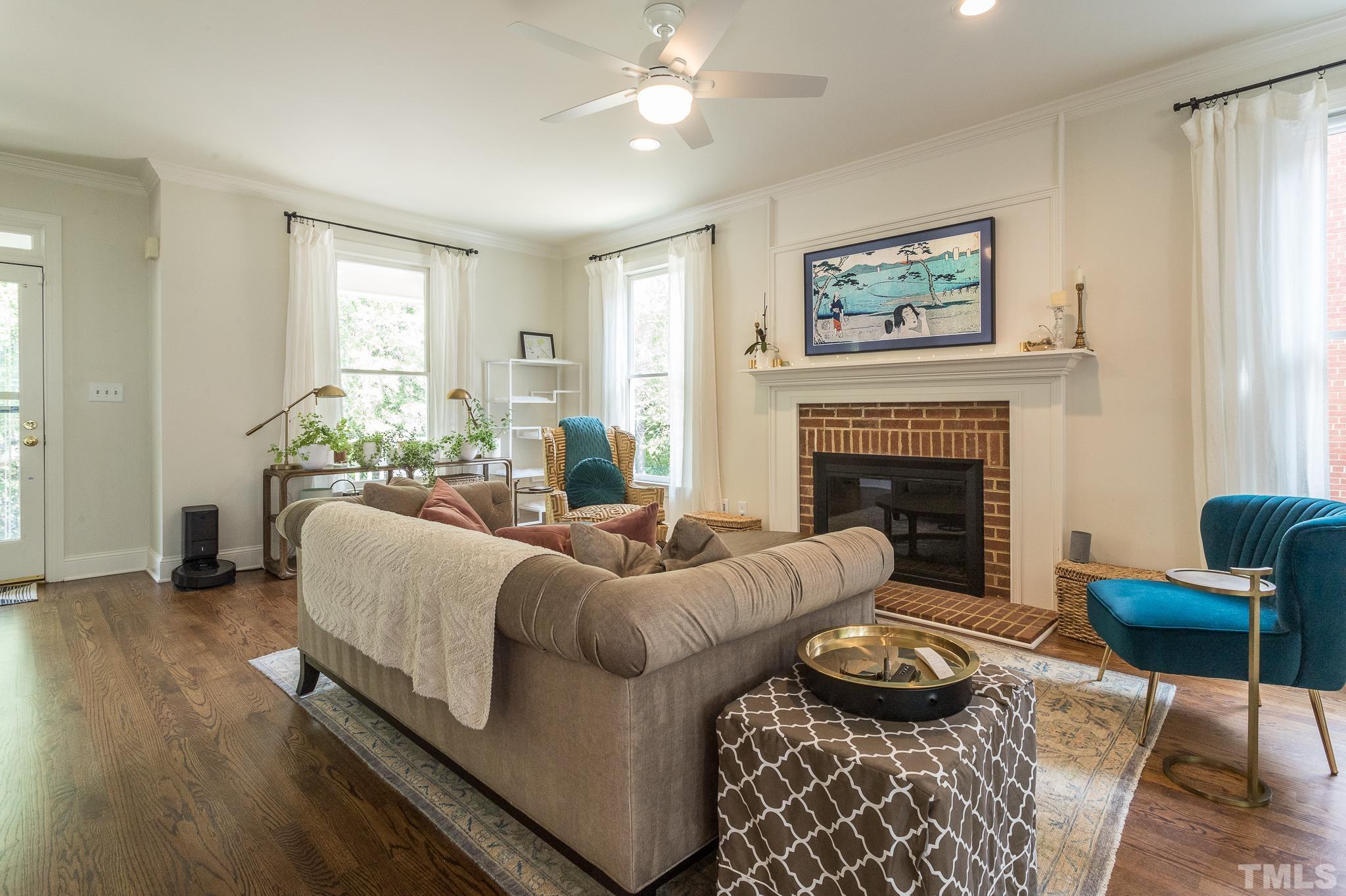 509 Watauga Street Raleigh, NC 27604 - Photo 7 of 26 a living room with furniture and a fireplace