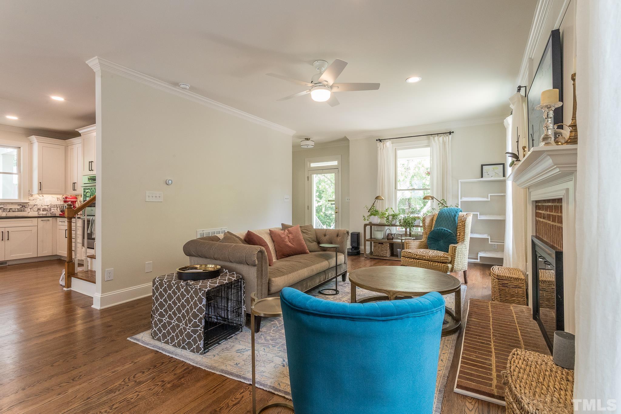 509 Watauga Street Raleigh, NC 27604 - Photo 8 of 26 a living room with furniture and a fireplace