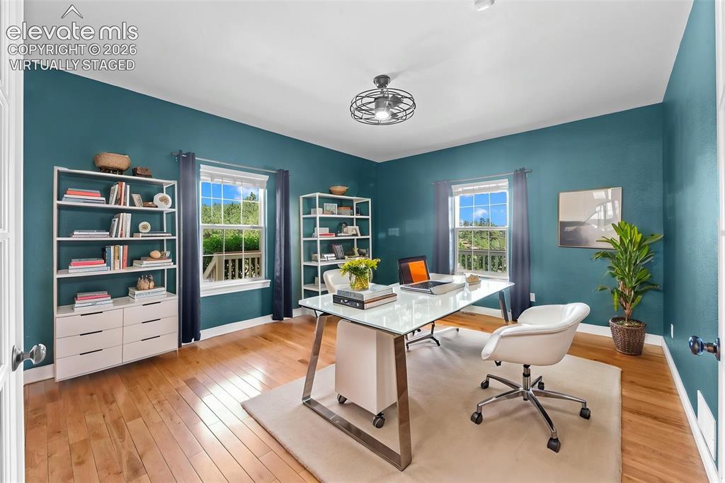 16540 Mesquite Road Peyton, CO 80831 - Photo 17 of 50 a view of a workspace with furniture and a window