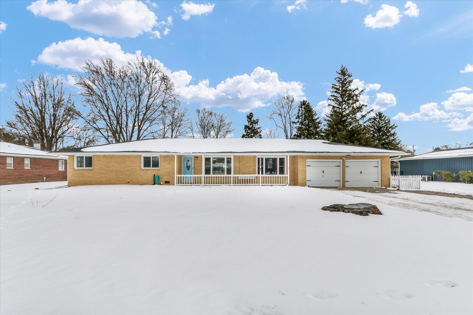 2218 South Mattis Avenue Champaign, IL 61821 - Photo 1 of 36 a front view of a house with yard and trees in the background