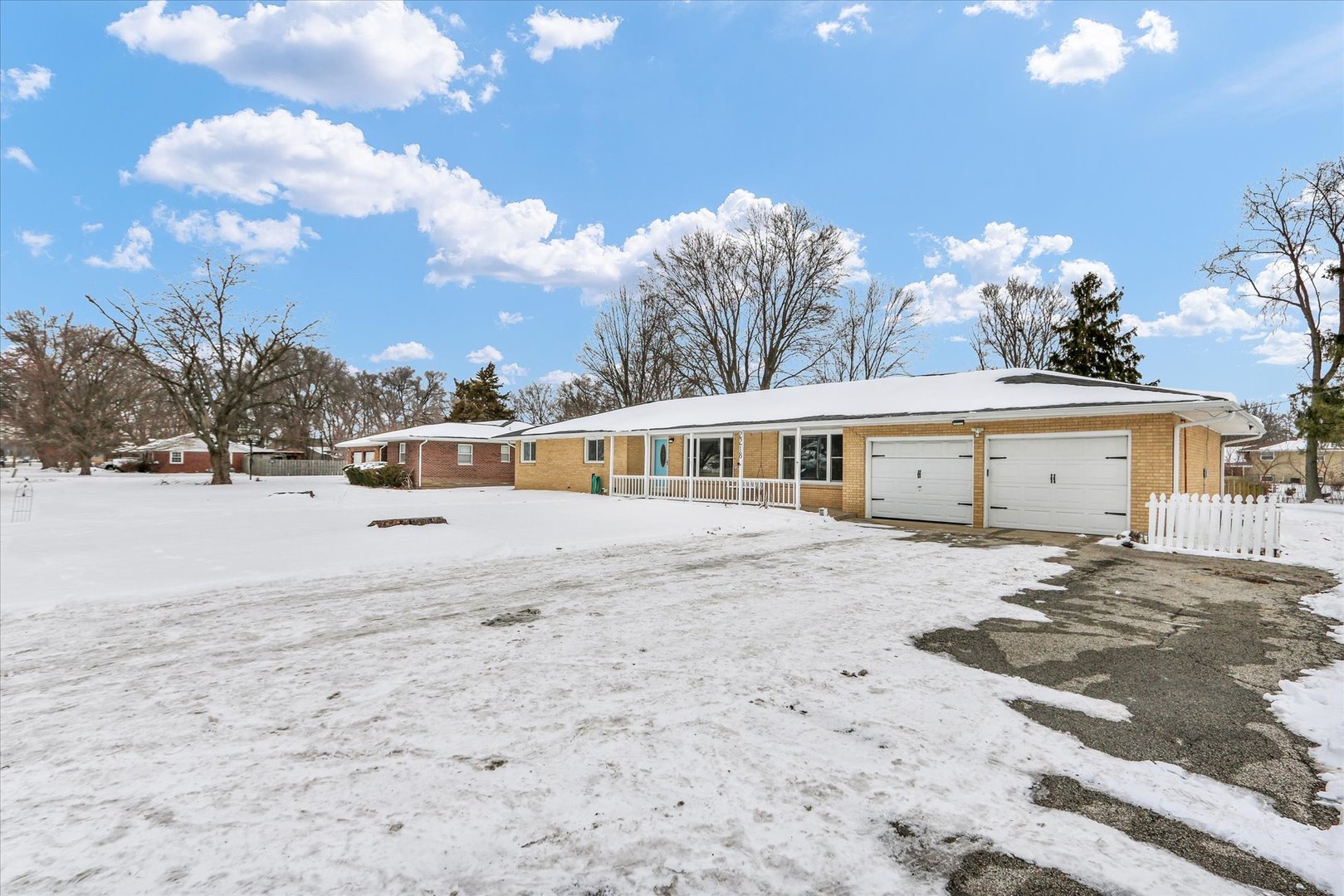 2218 South Mattis Avenue Champaign, IL 61821 - Photo 3 of 36 a view of a house with a yard and a garage