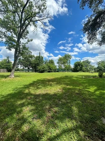 a view of a golf course with a yard