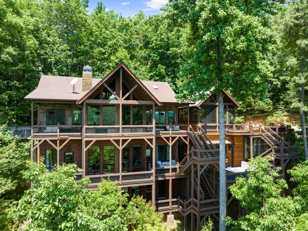 436 Geronimo Road Cherry Log, GA 30522 - Photo 58 of 58 a front view of a house with balcony and garden