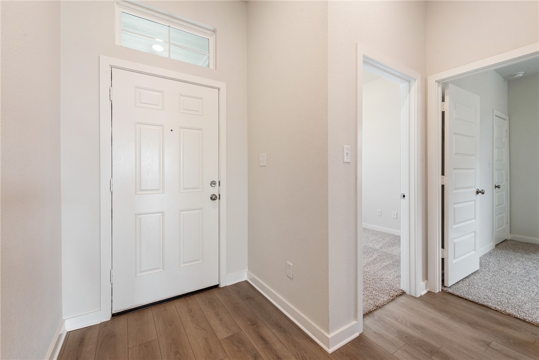 2415 Rooke Road Bryan, TX 77807 - Photo 6 of 36 a view of a hallway with wooden floor