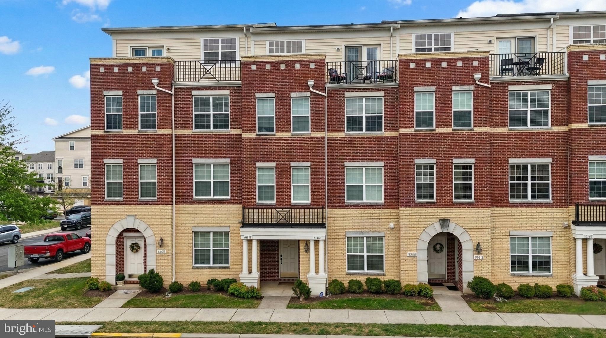 a front view of a building with garden