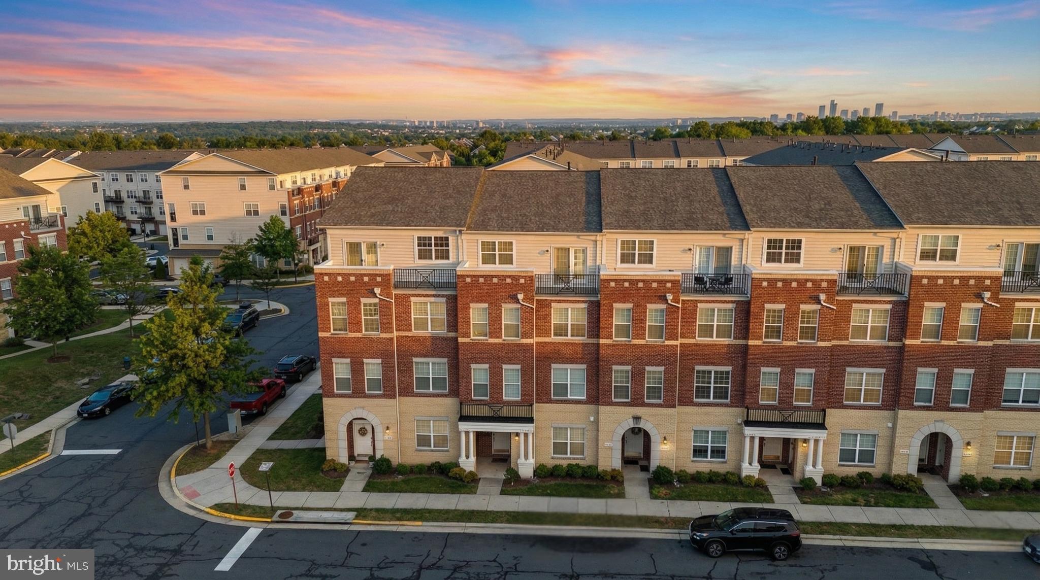 42575 Highgate Terrace Brambleton, VA 20148 - Photo 2 of 4 a view of a building with a yard