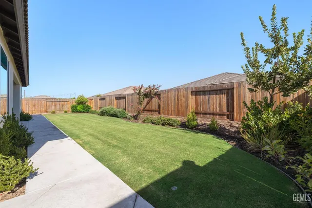 a front view of house with yard and outdoor seating