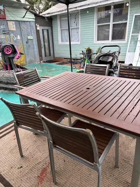 33 West F Street Frostproof, FL 33843 - Photo 7 of 10 a front view of a house with patio