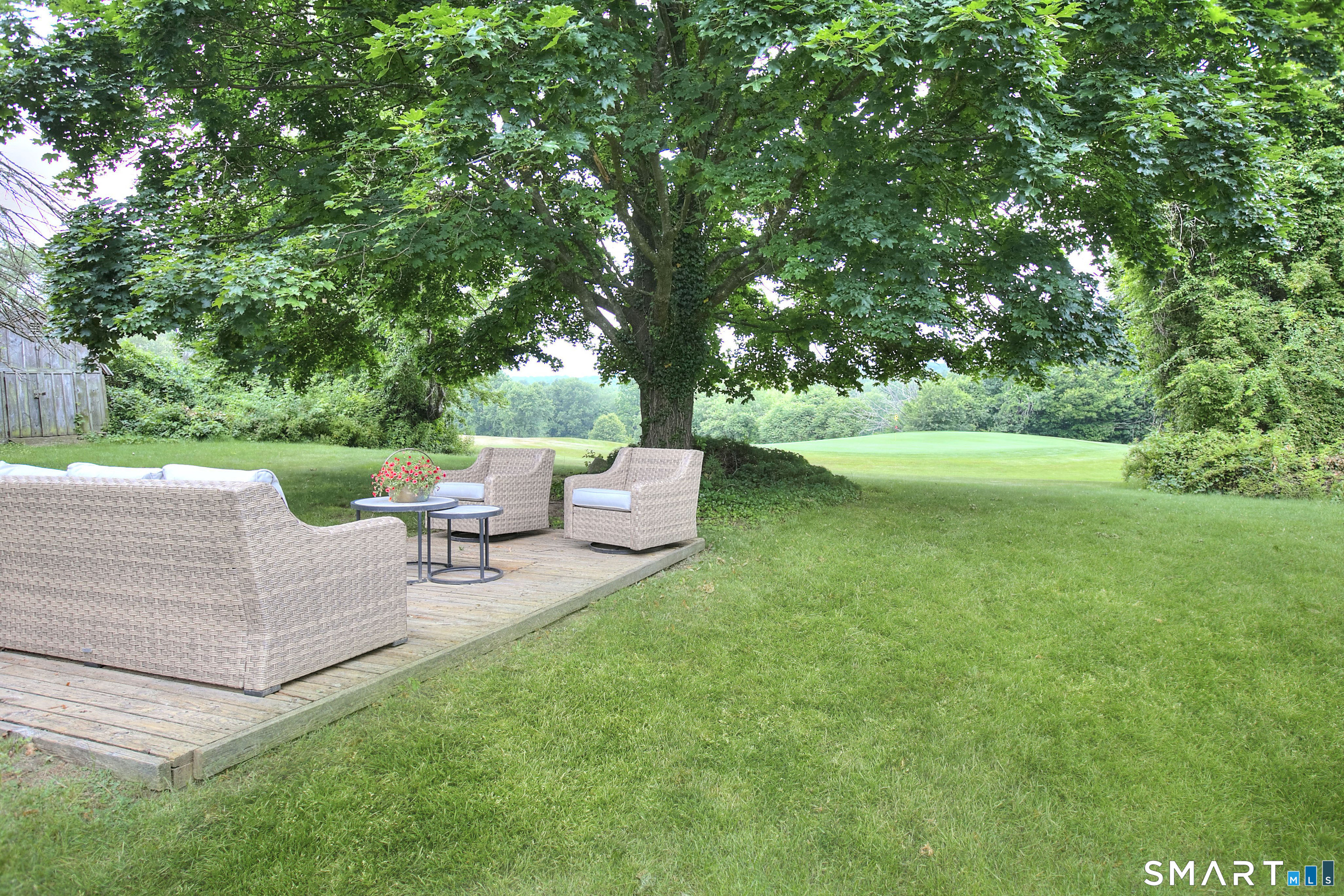 324 Ridge Road Orange, CT 06477 - Photo 32 of 38 a view of backyard with green space and patio