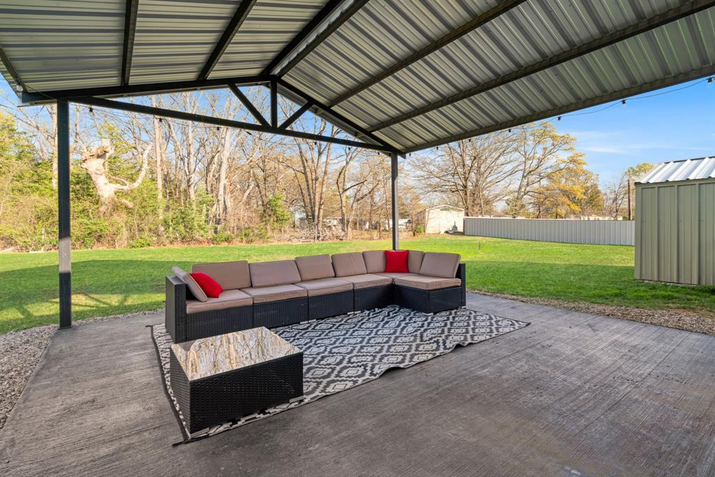 324 Private Road Paris, TX 75462 - Photo 14 of 15 a outdoor living space with furniture and garden view