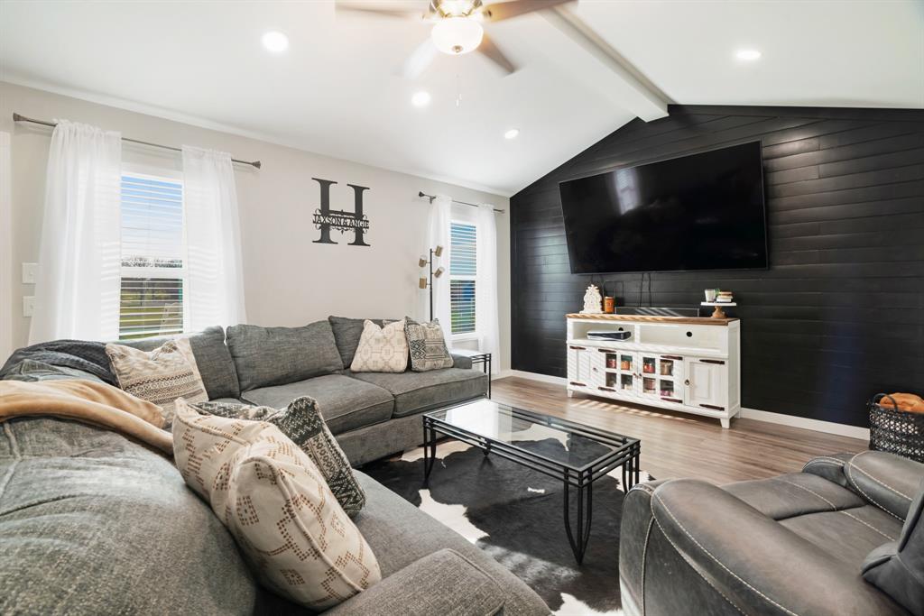324 Private Road Paris, TX 75462 - Photo 4 of 15 a living room with furniture and a flat screen tv