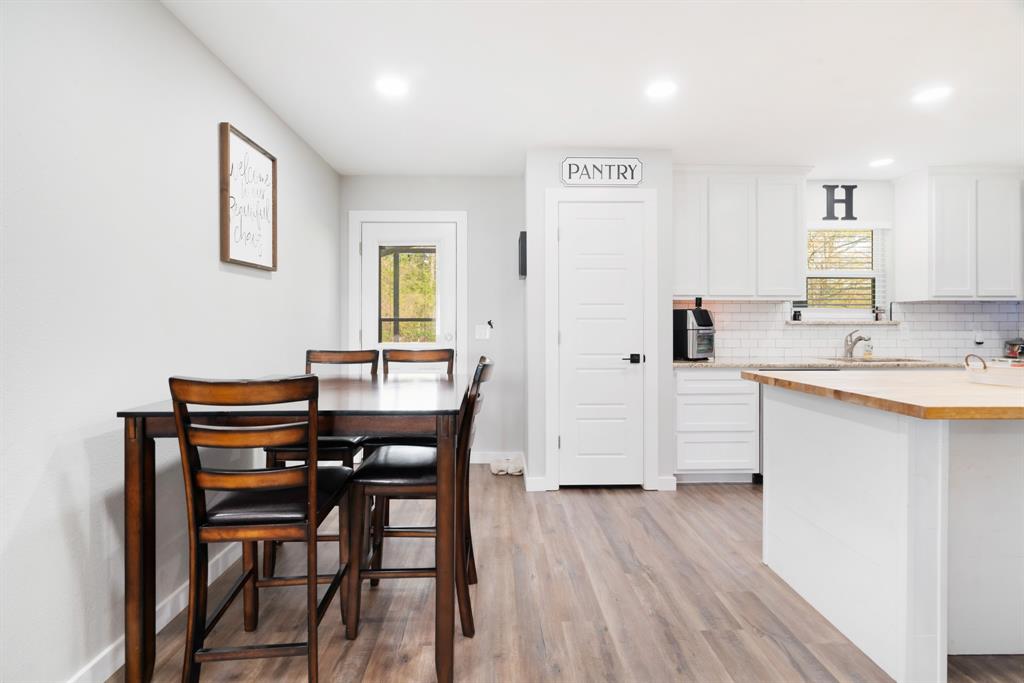 324 Private Road Paris, TX 75462 - Photo 5 of 15 a view of a dining room with furniture and wooden floor