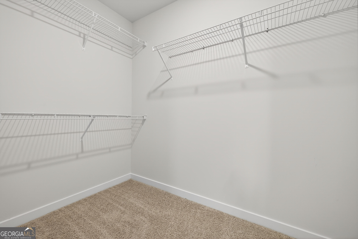 206 Airport Road, Unit 11 Canon, GA 30520 - Photo 26 of 34 a view of a room with racks on the wall