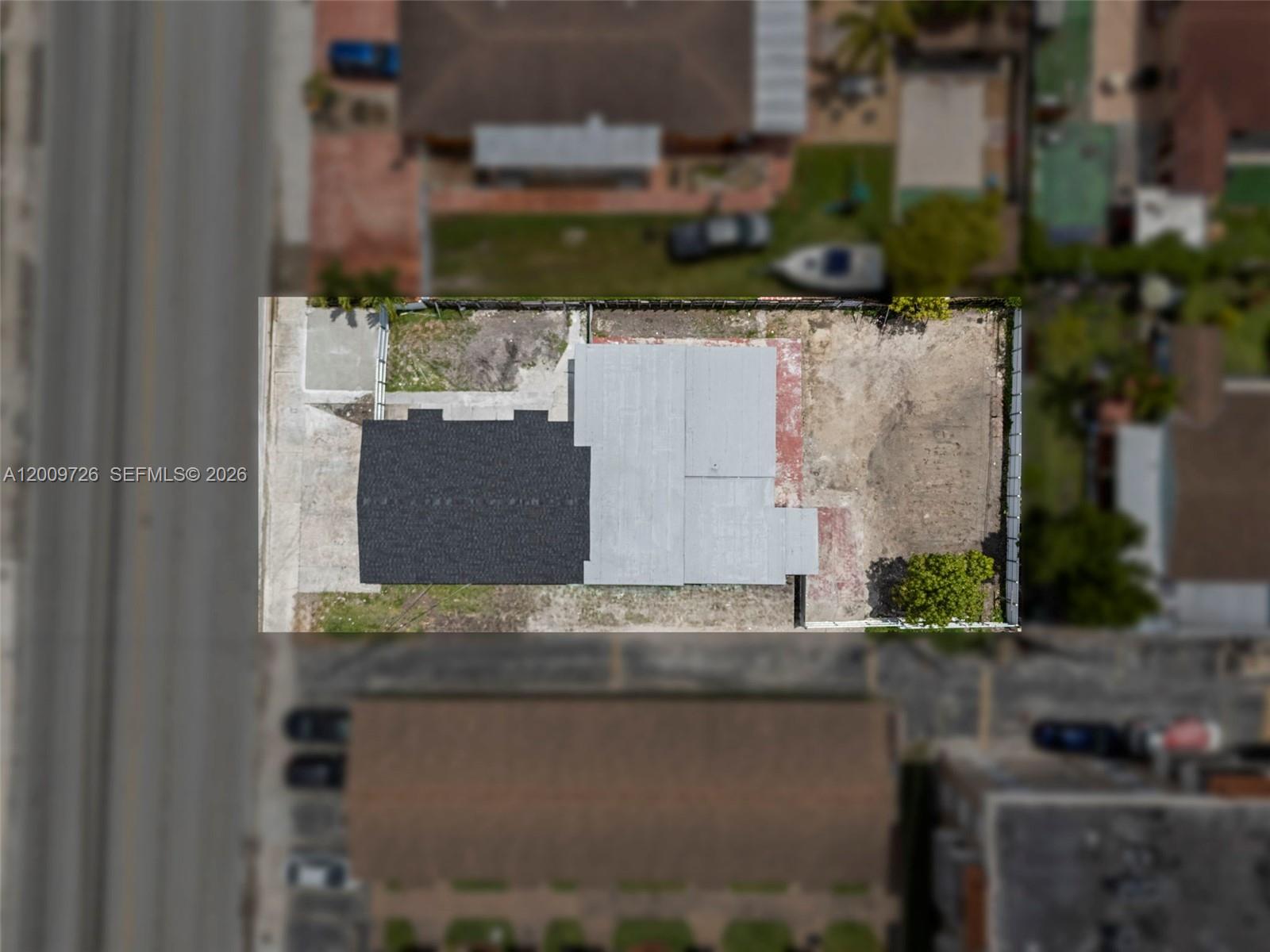 1370 West 29th Street, Unit A Hialeah, FL 33012 - Photo 3 of 16 an aerial view of a house with a yard