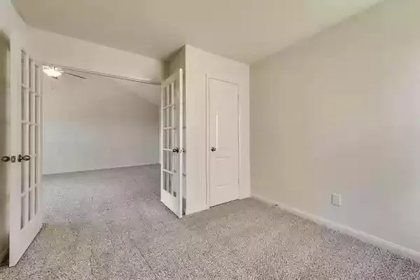 a bathroom with a glass shower door